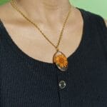 Amber Petal Pendant necklace worn on neck