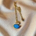 Blue Swan Pendant flat lay, elegant swan-shaped resin pendant