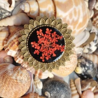 Close-up of Crimson Lace Ring handmade with real red flower