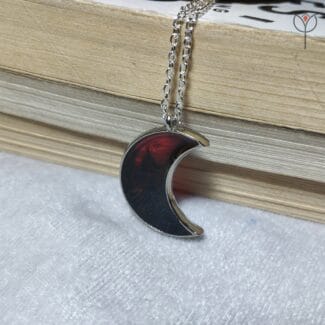 Crimson Moon pendant with deep red resin design