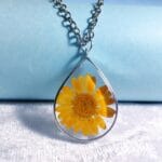 Detailed of real yellow daisy inside resin Dewbloom Pendant