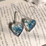 Silver heart Lace of Love Earrings with blue blooms
