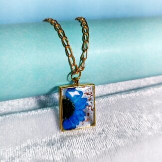 Close-up of Ocean Blossom Pendant – blue flower necklace