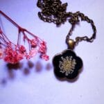 Close-up view of Shining in Dark luminous pendant details