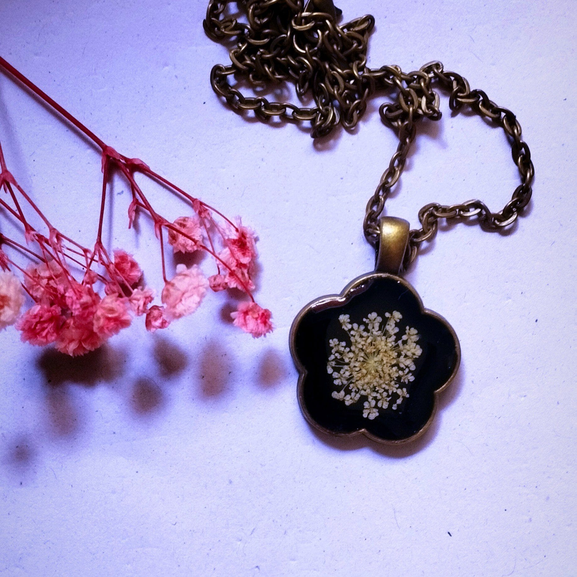 Close-up view of Shining in Dark luminous pendant details