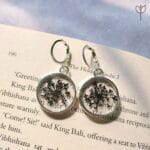 Close-up of Winter Lace Earrings showing delicate lace flower detail