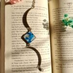 Floral resin bracelet featuring blue baby’s breath