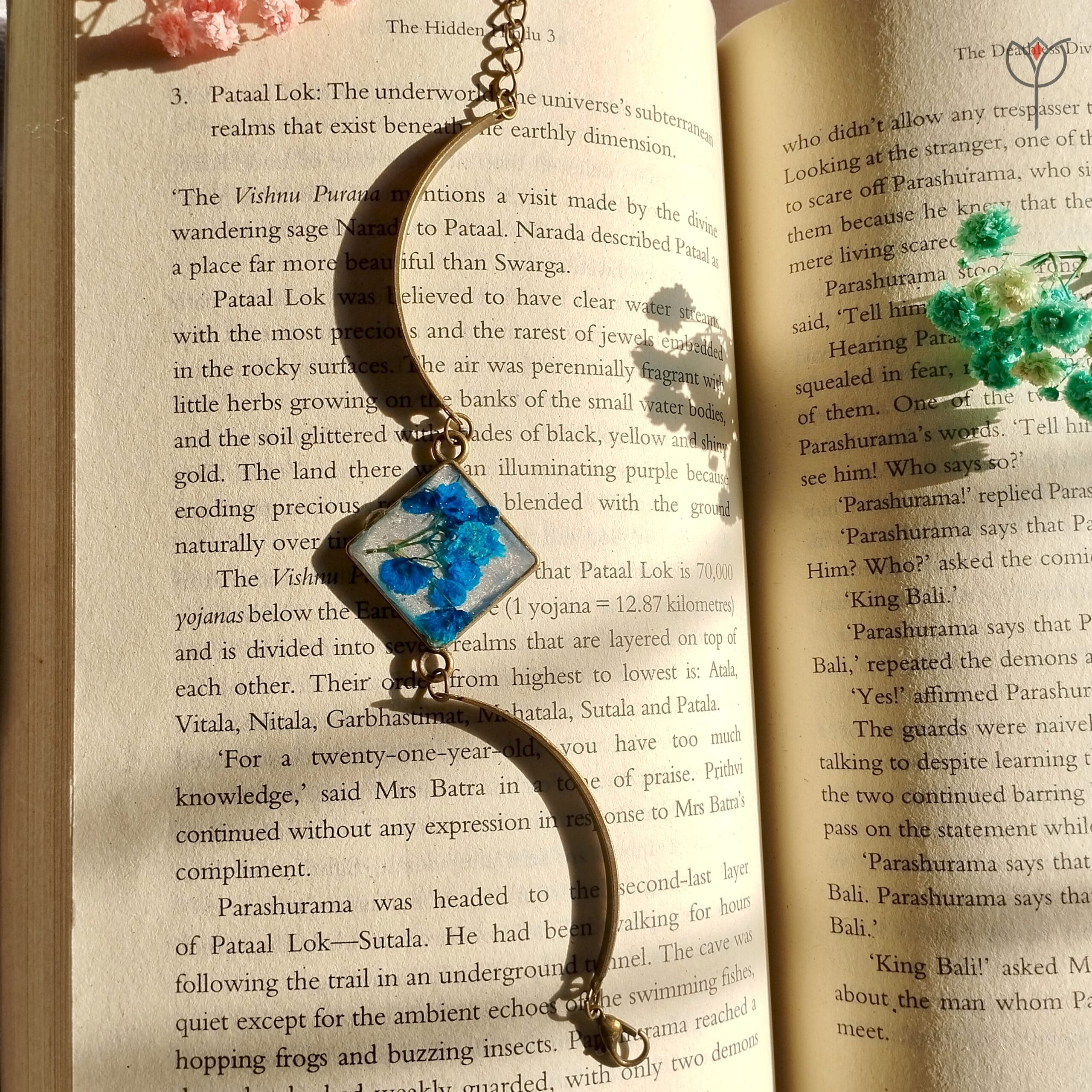 Floral resin bracelet featuring blue baby’s breath