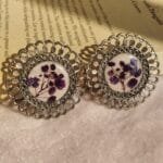 Floral resin jhumka featuring real baby’s breath