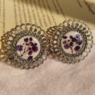 Floral resin jhumka featuring real baby’s breath