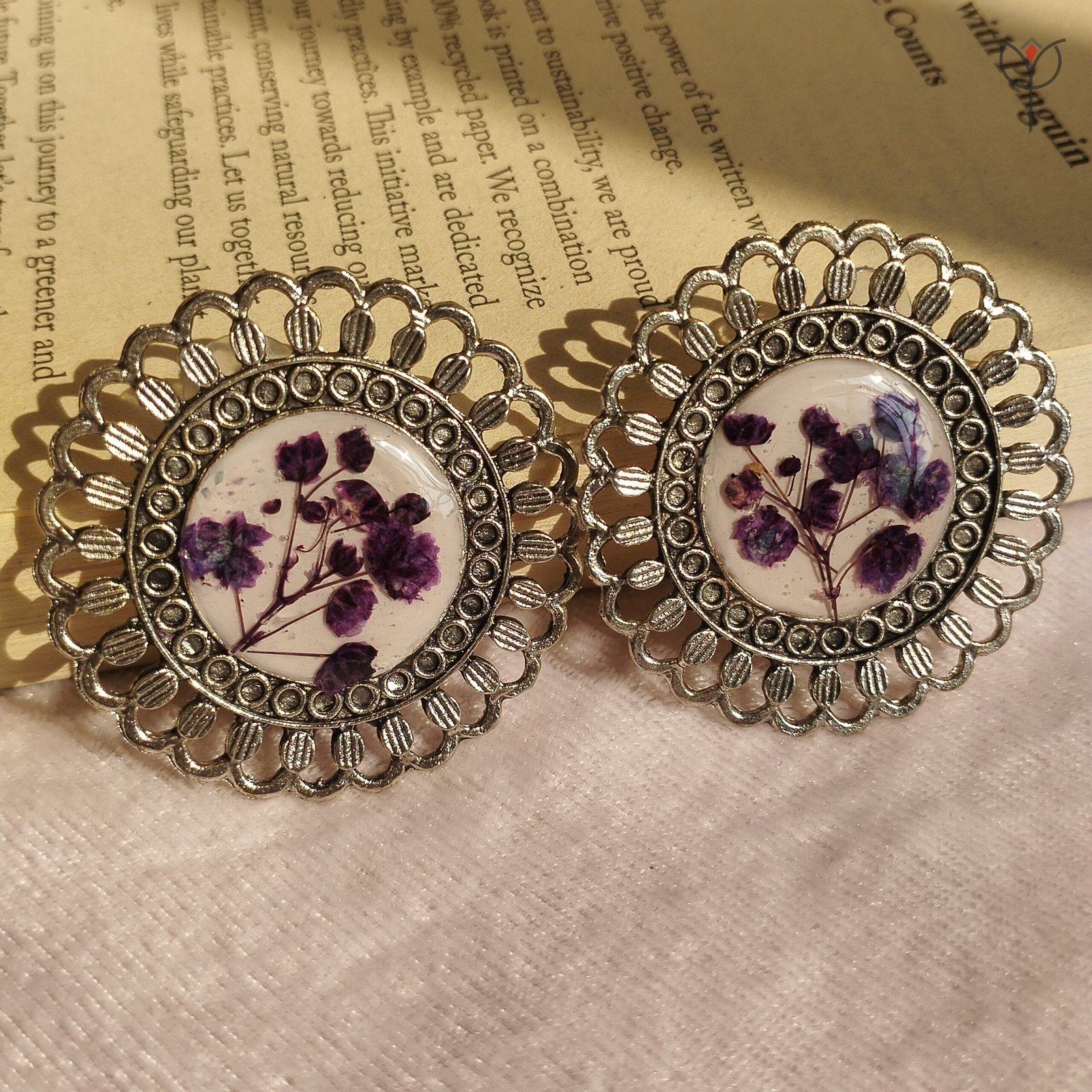 Floral resin jhumka featuring real baby’s breath