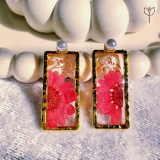 Closeup of Daisy Wish Earrings with real flowers