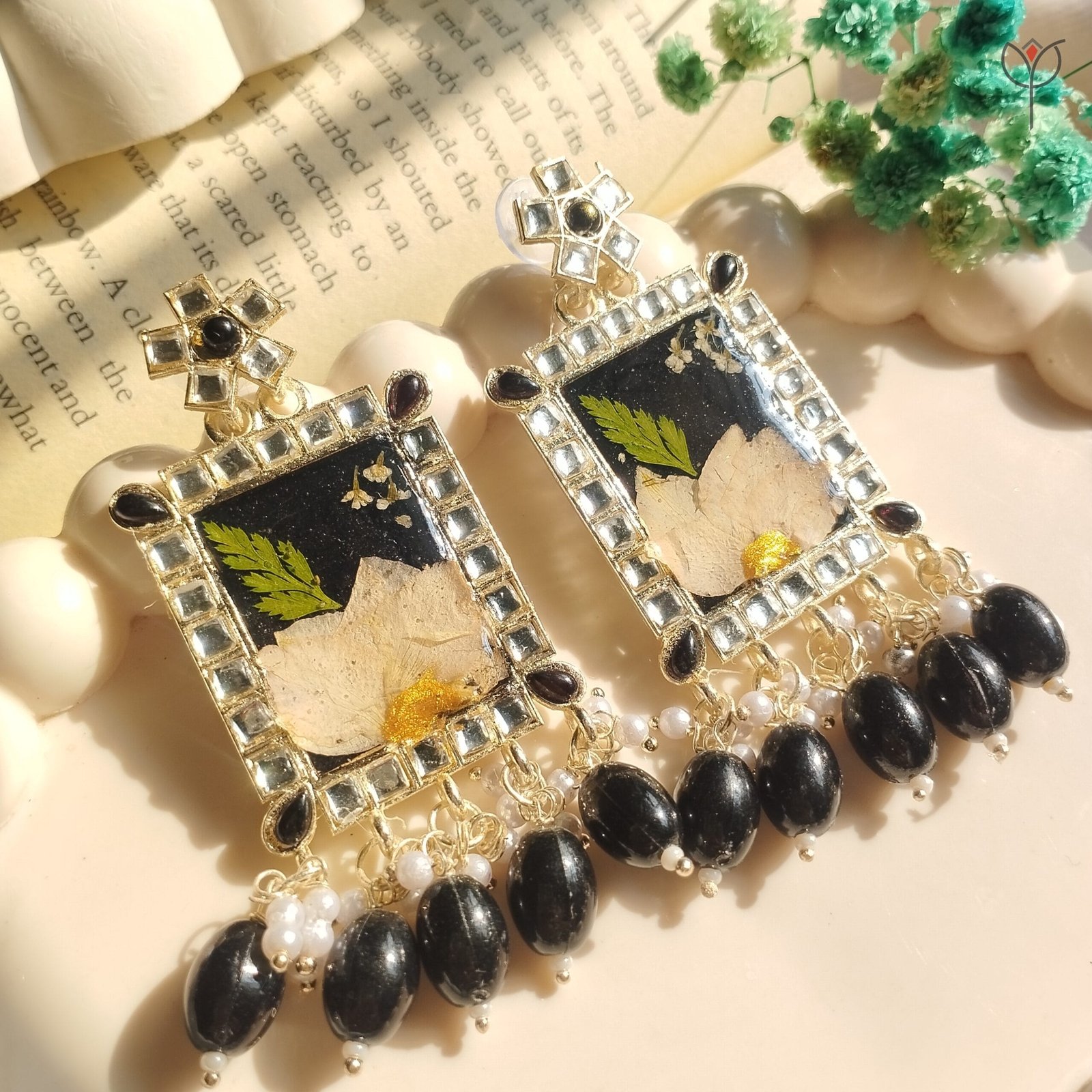 dreamy-frame-jhumka-camellia-fern-resin Handcrafted resin jhumka with camellia flower and fern leaf