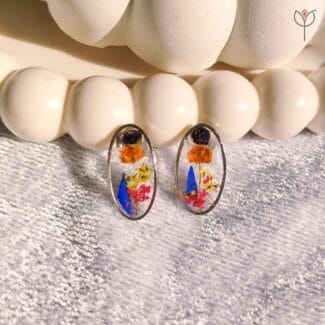 Resin earrings with Queen Anne’s lace, baby’s breath, and camellia petals