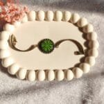 Handmade resin bracelet featuring preserved green aster