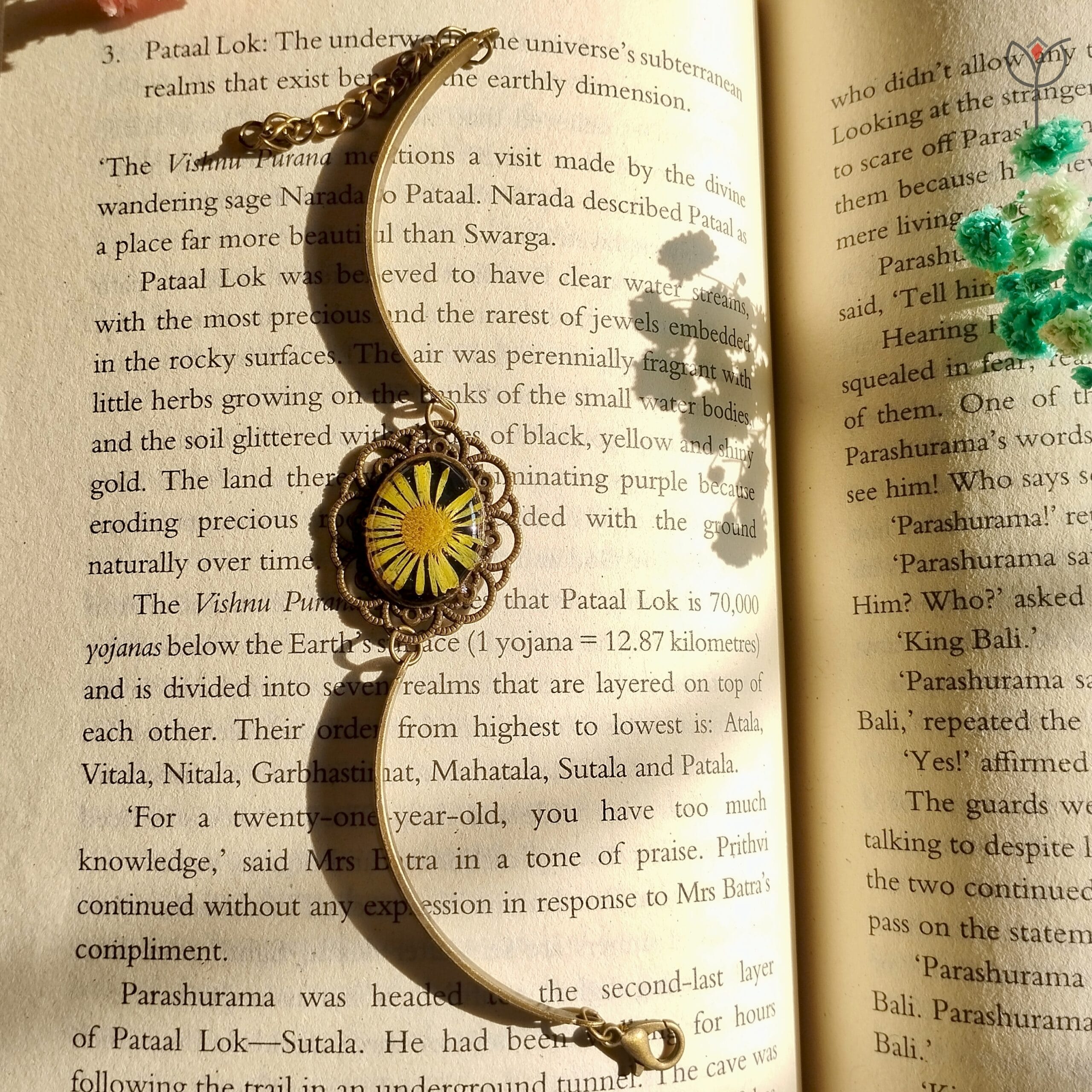 Artisan bracelet showcasing a real aster flower