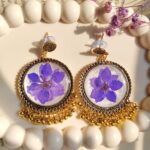 Handcrafted resin jhumka featuring preserved flower petals