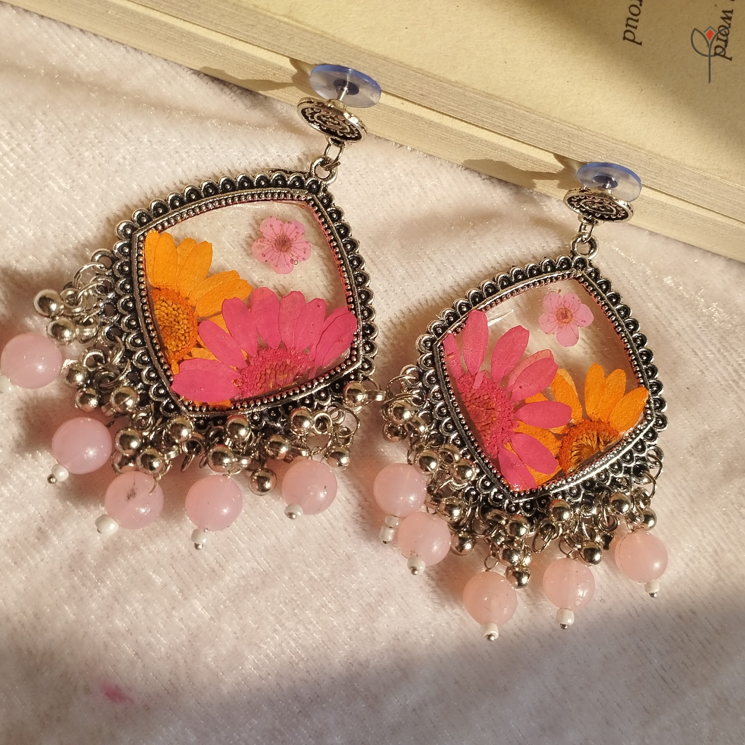 Floral resin jhumka inspired by a quiet meadow