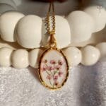 Front view of Meadow Whisper wild flower resin pendant