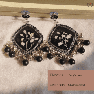 Handcrafted resin jhumka featuring preserved flowers