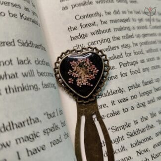 Black heart-shaped pressed flower bookmark