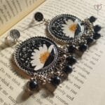 Floral Jhumka with black beads.