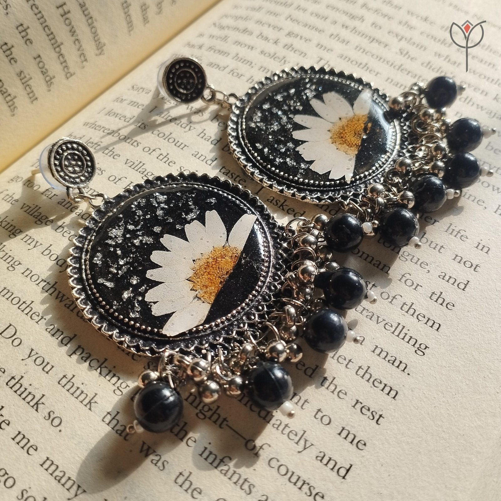 moonlit-resin-jhumka-botanical-earrings Floral Jhumka with black beads.
