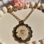 Moonveil Camellia floral pendant front look