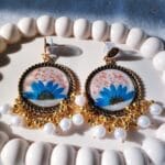 Neel Mayuri Jhumka with preserved blue flower