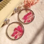 Handmade silver oxidised jhumka with soft pink baby’s breath flowers