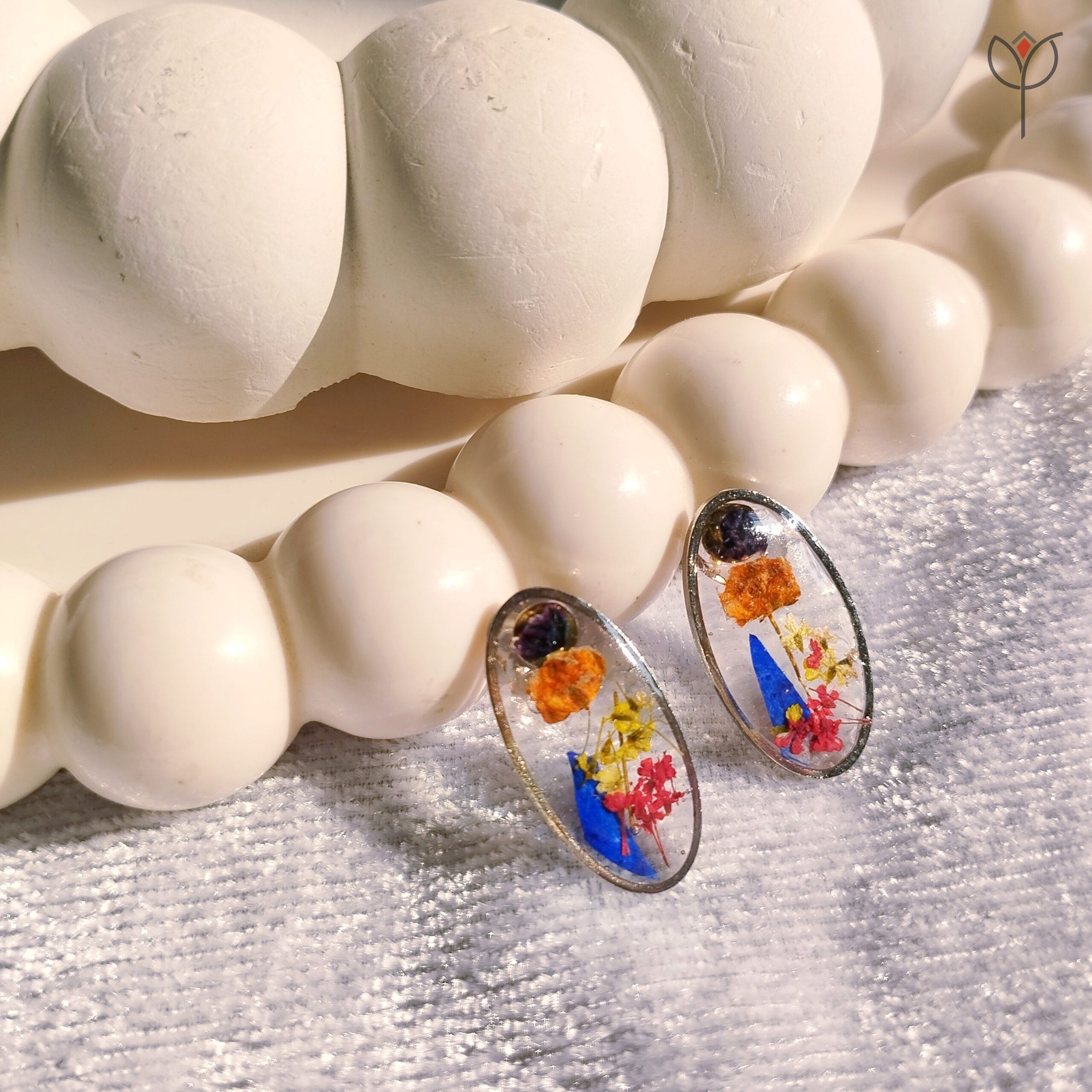 Oval resin earrings with colourful preserved flowers