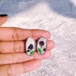 Oval resin earrings with purple Baby’s Breath and fern leaf
