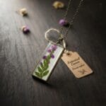 Vertical antique resin pendant featuring real fern and purple flowers