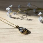 Vintage style teardrop pendant featuring real