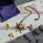 Vintage sunburst pendant featuring real yellow plum