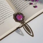 Pressed pink aster flower bookmark with antique base