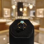 Golden star ring featuring preserved plum