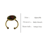 Dark floral ring with red rose accents and fern leaf