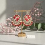 Resin jhumkas with daisy and fern leaf