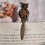 Decorative owl-shaped bookmark with real flower