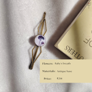 Handcrafted resin hair clip on antique base