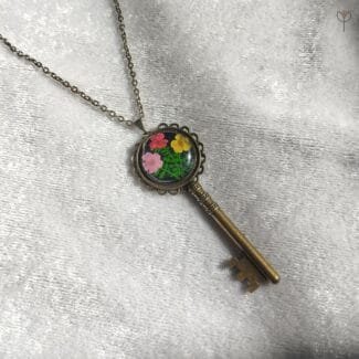 Plum Garden Key Pendant with preserved fern leaf and flower