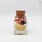Mini sunflower preserved in mineral oil glass bottle