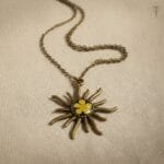 Sunflare Blossom Pendant with preserved dried plum