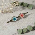 Twin Ember Bloom hair clip with red starburst bush