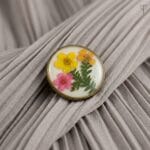 Ancient Meadow Resin Brooch featuring a vintage antique finish