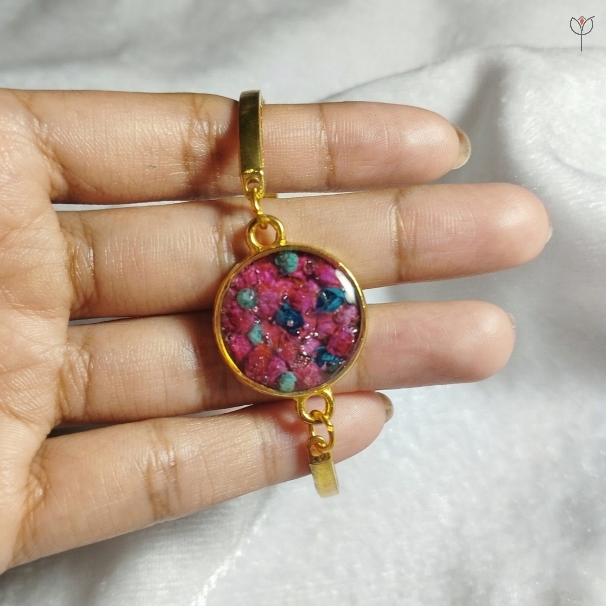 Berry Bloom Bracelet featuring pink dried flowers in a golden frame