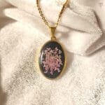 Handcrafted gold necklace featuring the Midnight Petal Orbit Pendant