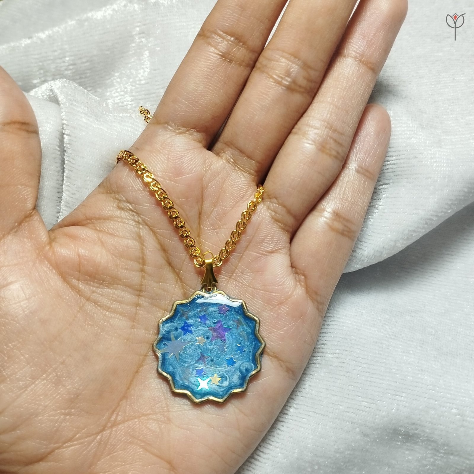celestial-starry-gold-pendant Handcrafted cosmic necklace featuring holographic stars and azure resin