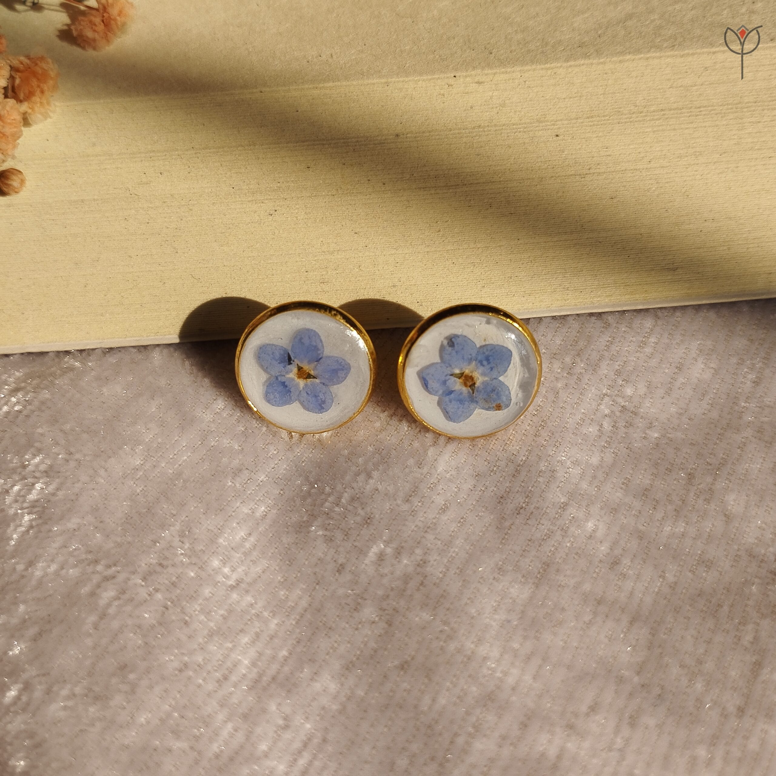 Blue forget-me-not flowers in clear resin